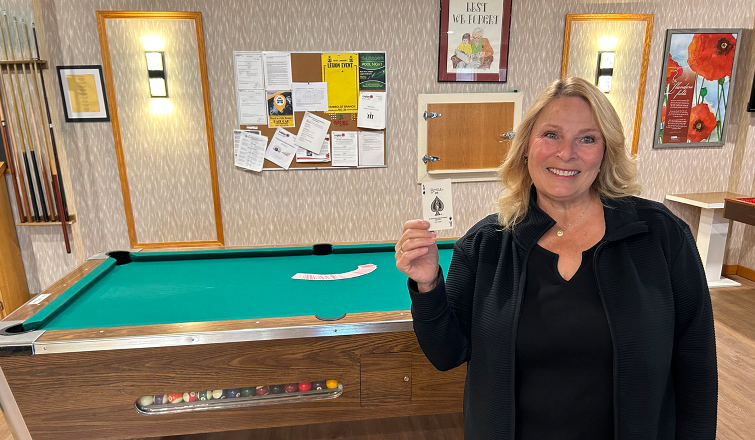 Beautiful Lady Holding the Ace of Spades for the Chase the Ace Lottery